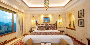 A bedroom at the Serena Hotel Presidential Suite