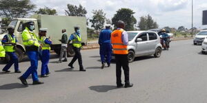A photo of NTSA and police officers conducting an operation in Nairobi County.