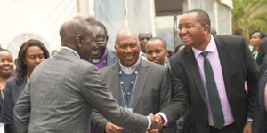 KEMSA Board Chair Irungu Nyakera greeting President William Ruto during the official opening of the MEDS’ Microbiology Laboratory on November 22, 2023.