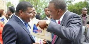 Former Limuru MP George Nyanja (left) with President Uhuru Kenyatta in 2013.