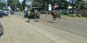 A photo of police officers conducting an operation in Nyeri after banning a planned Mungiki meeting on December 31, 2023.