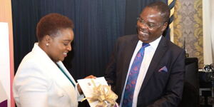 EACC Chairperson David Oginde (right) and Health Cabinet Secretary (CS) Susan Nakhumicha hold a report in Nairobi on May 17, 2023.