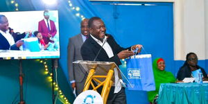 Philanthropist Kennedy Odede addressing a congregation during a meeting