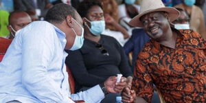 President Uhuru Kenyatta shares a light moment with ODM leader Raila Odinga at the Jaramogi Oginga Odinga Stadium on October 22, 2020