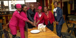 Officials and crew members from Jambojet Limited cutting cake on April 2, 2024