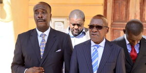 Lawyer Danstan Omari (left) and Kakamega senator Boniface Khalwale outside Milimani Law Court on February 7, 2024.