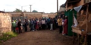 A file image of onlookers at a scene of crime