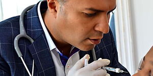 Dr Pranav Pancholi the founder of Avané Dermatology Clinic performs a procedure on a patient.