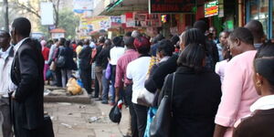 Passengers waiting in line for a public service vehicle