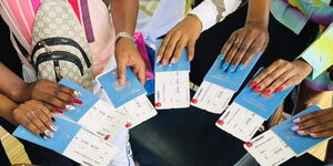 A photo of Kenyans holding passports.