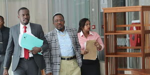 Pastor James Ng'ang'a (centre) alongside National Assembly Majority Whip Sylvanus Osoro (left) appearing at National Assembly Committee on March 14, 2024.