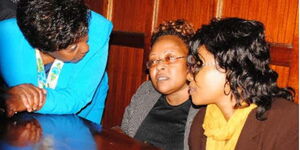 Kitui Governor Charity Ngilu (left) with co-accused Sara Mwendwa (centre) and Polly Wanjiku (right) at the Milimani law courts in July 2015.