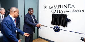 PCS Musalia Mudavadi cuts a ribbon during the launch of Bill and Melinda Gates office in Nairobi.