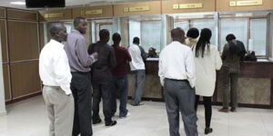 Kenyans queue to join a Sacco. 
