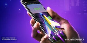 A person holding a phone and using the Pepeta Bet app.