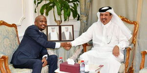 Performance CS Moses Kuria (left) greets the Vice Chairman of the Qatar Chamber of Commerce Sheikh Mohammed Bin Twar Al Kuwairi in Doha.