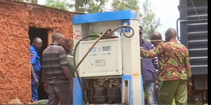 Police officers raid a pump station installed in a private house in Sosiot, Uasin Gishu County on Sunday, June 4, 2023.