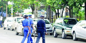 Police officers conduct a routine patrol along the streets of Nairobi.