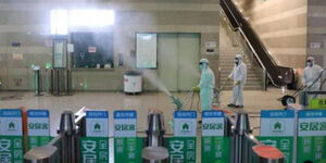 A photo of Workers in protective suits disinfect the Shanghai Hongqiao Railway Station following the Coronavirus outbreak on January 27, 2020