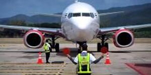 A plane in a runway at an airport