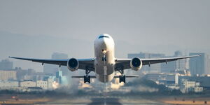 A plane taking off from an airport on July 12, 2022