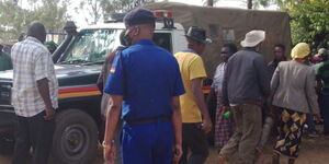 An image of a police officer and a police van at a crime scene 
