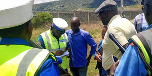 Police officers and a team from NTSA during a roadcheck along the Nairobi-Mombasa Highway on Wednesday March 27, 2024