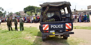 Police officers and their landcruiser at a past crime scene