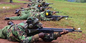 Police officers participate in a shooting range at Kiganjo 