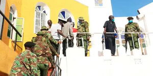 Police officers conducting a raid at the Coptic Holy Ghost Church of Fr. John Juma Pesa in Kisumu on August 5.