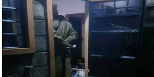 A photo of a police officer at the home of the slain Archdeacon in Kathande Embu County on January 15, 2024