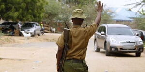 A police officer stops a motorist in Garissa, northeast Kenya on January 11, 2016.