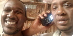 President Uhuru Kenyatta's lookalike (right) with a friend