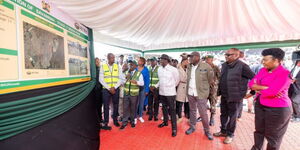 President William Ruto alongside Nairobi Governor Johnson Sakaja and other officials inspecting a project plan in Nairobi on Thurday, July 17.