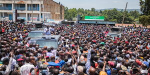 President William Ruto atop a vehicle addressing residents from Bomet Town on March 16, 2024