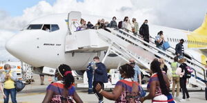 Travellers at an airport in Africa.