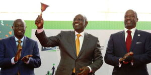 President William Ruto rings a trading bell.