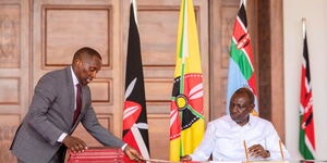 President William Ruto with National Assembly Clerk Samuel Njoroge, during the signing of the Computer Misuse and Cybercrimes (Amendment) Act, 2024, at State House, Nairobi, October 15, 2025.
