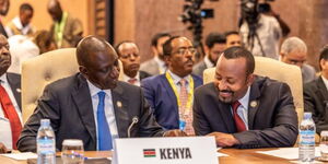 President William Ruto (left) and Ethiopia's Prime Minister Abiy Ahmed at the 19th Non-Aligned Movement (NAM) Summit, Kampala, Uganda on January 19, 2024.