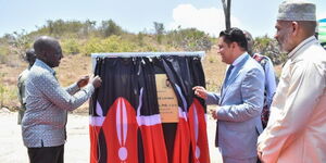 President William Ruto (left) and business tycoon Rostam Aziz unveil a plaque at Dongo Kundu in Mombasa on February 24, 2023.
