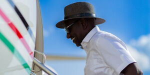 President William Ruto boarding a plane 