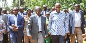 President William Ruto (center) and Education CS Ezekiel Machogu durng a visit of the  Kisii National Polytechnic Digital Empowerment Centre on March 23, 2023.