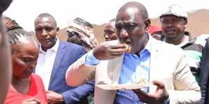 President William Ruto enjoys a meal with supporters during Mariga's thanksgiving party at Bomas of Kenya in 2019.