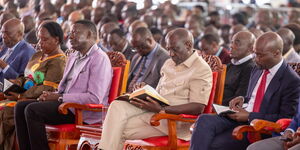 President William Ruto (in Kaunda suit) and Energy CS Davis Chirchir (his right) at a church service in Bomet.