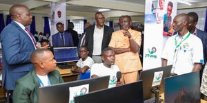 President William Ruto (in Kaunda suit ) interacting with students at a Jitume lab in Nandi County on January 16, 2024