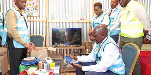 President William Ruto inspects kits to be used by health promoters