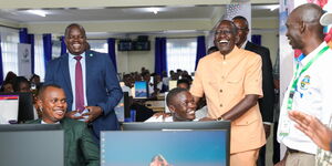President William Ruto interacting with a student at a Jitume lab in Nandi on January 16, 2024