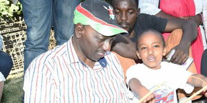 President William Ruto (left) and gymnast Wendy Waeni.