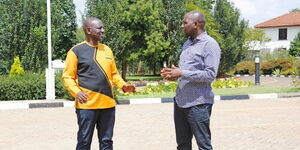 President William Ruto (left) chatting with Transport CS Kipchumba Murkomen (right)