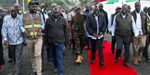 President William Ruto (left on red carpet) accompanied by leaders in a visit to Vihiga County.